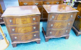 Near pair of serpentine fronted reproduction three flight chests of drawers