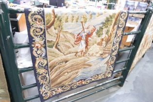 Tapestry wall panel decorated in Italian style with courting couple and foliate border,