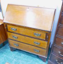 Edwardian inlaid mahogany bureau fitted with three drawers with brass drop handles and raised on