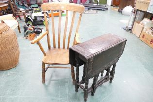 Oak spindle back armchair and ebonised carved twin drop flap low gate leg table