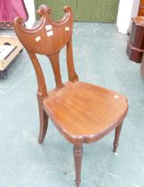 Regency mahogany hall chair in manner of Gillows with shaped seat and raised on turned front legs.