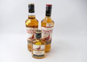 Two 70 cl and one 200 ml bottles of Famous Grouse Whisky
