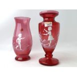 Two Mary Gregory style cranberry glass vases,