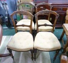 Four late 19th century gold button upholstered dining chairs