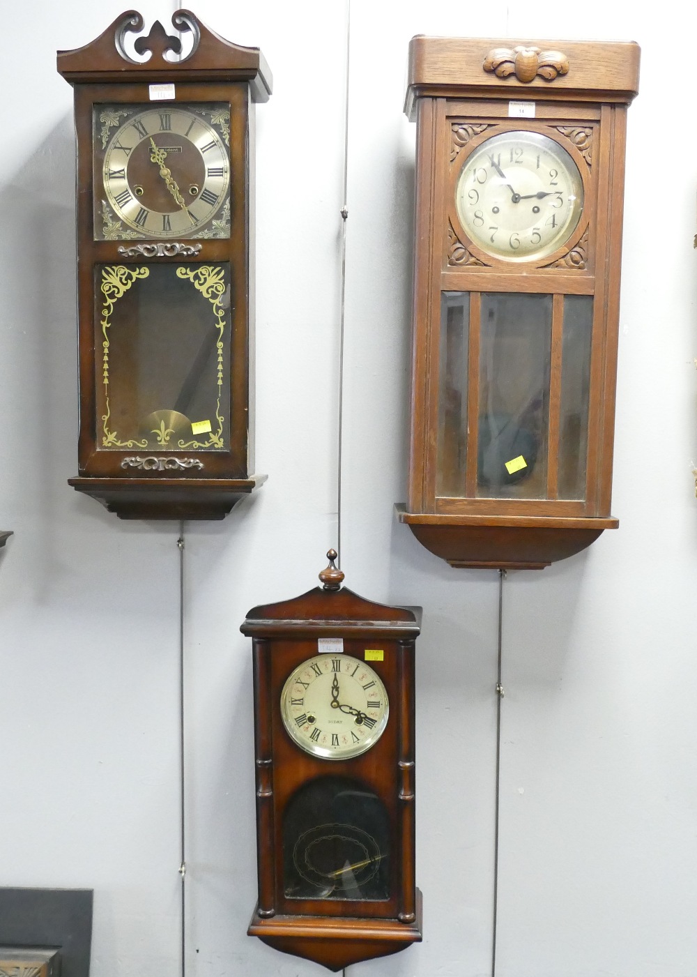 Three wooden wall clocks, President, 31 day, etc.