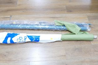 Roll of green fabric and projector screen