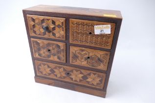 Small set of wooden desktop drawers with marquetry detail,