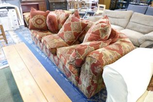 Substantial red and gold floral upholstered settee,