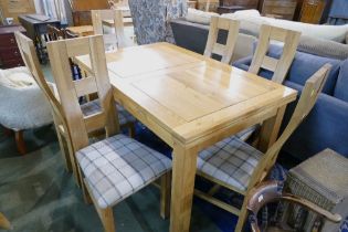 Good quality modern extending table and matching chairs