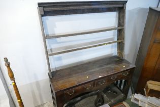 Unusual early 19th century dresser base with mismatched Delft rack