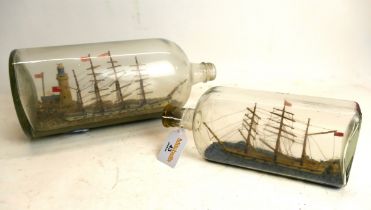 Two model ships in bottles. Largest bot