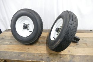 Two trailer wheels and suspension units