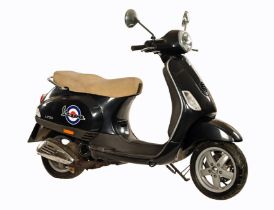Black Piaggio Vespa LX50 scooter, 50 cc