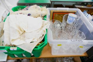 Two boxes of glassware, fabric including needlepoint,