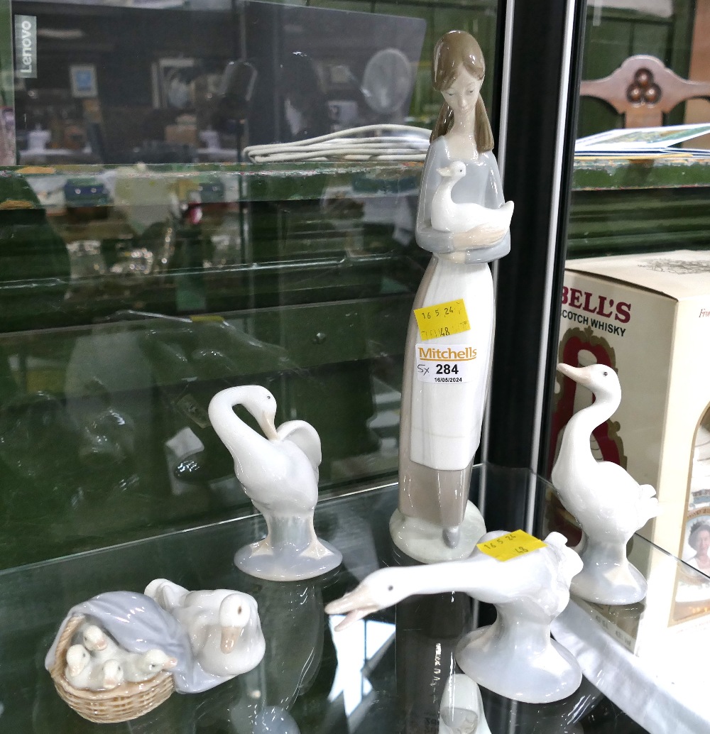 Nao figurine and four Lladro geese