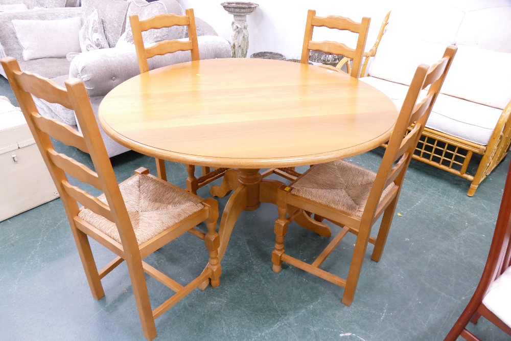 Circular kitchen table and rush seated chairs