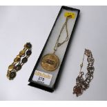 Oriental abacus themed yellow metal pendant on chain and two yellow metal gate bracelets,