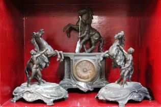 Metal mantel clock with rearing horse decor and pair of matching garnitures,