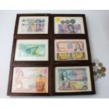 Framed world banknotes and loose coins