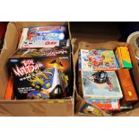 Two boxes of board games and jigsaws including Total Melt Down, Polar Panic,