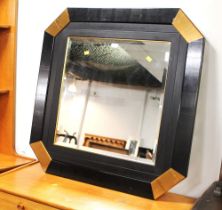 Modern octagonal black and gold coloured wall mirror,