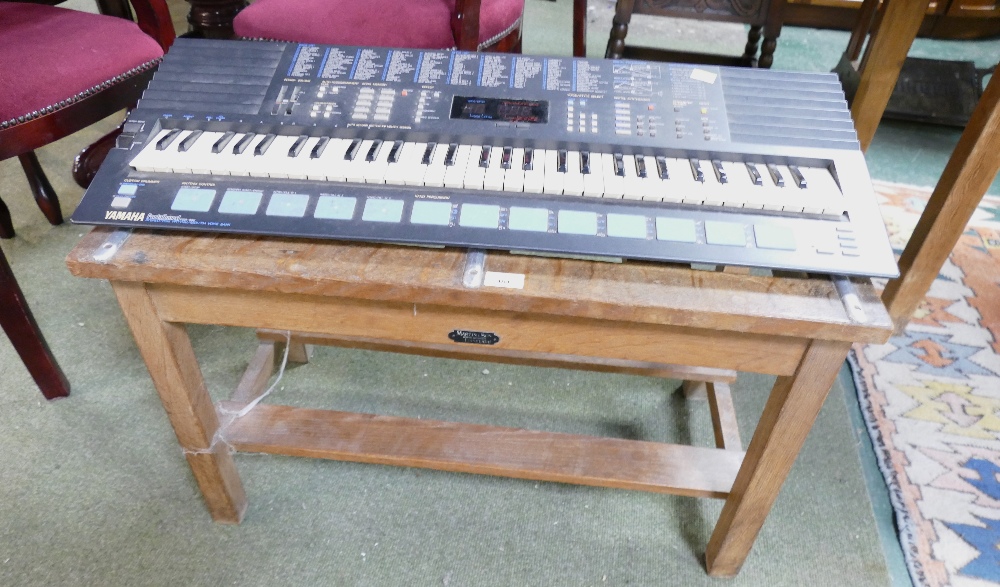 Wooden suitcase stand and vintage Yamaha PortaSound keyboard