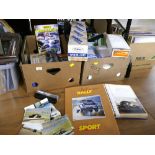 Two boxes of motorcar rallying memorabilia, Velbon tripod,