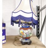 Bulbous ceramic painted lamp base with blue and cream shade,