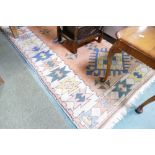 Geometric patterned rug, width 135 cm,