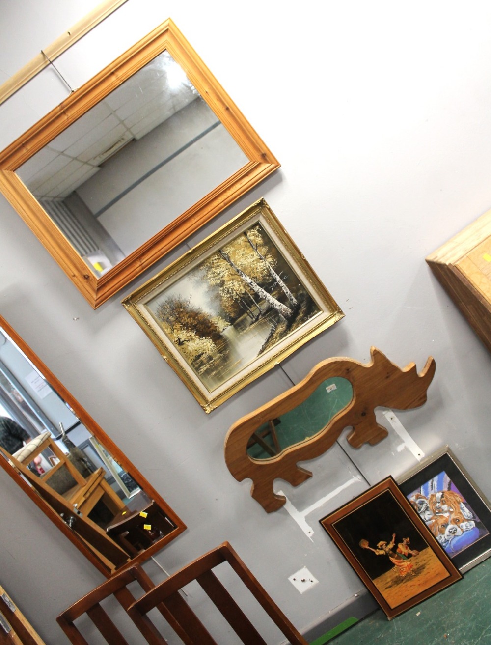 Rectangular wooden rhino form framed mirror and three pictures