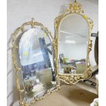 Two wall mirrors in ornate coloured fretwork frames,