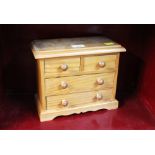 Miniature pine set of drawers,