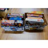 Two boxes of board games, Pass The Bomb, The Logo Board Game, Monopoly,