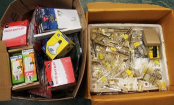 Two boxes of clock repairing parts, light bulbs,