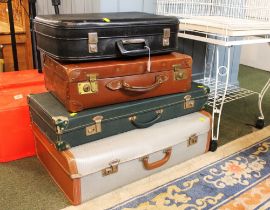 Four vintage suitcases