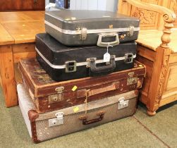 Four vintage suitcases