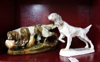 Two porcelain hunting dog figures both with indistinct marks to base