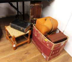 Box of leather bags and suitcases,