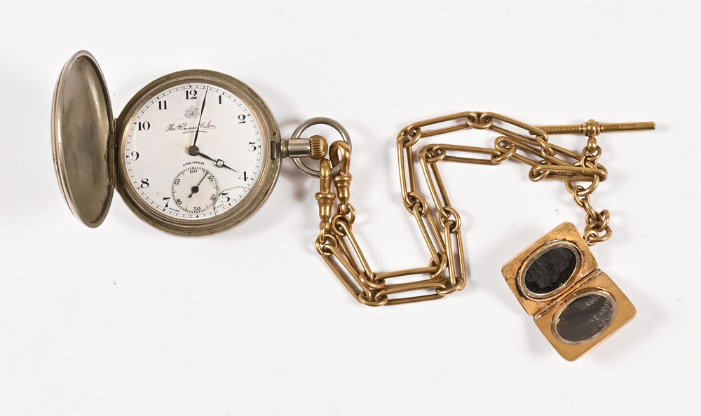 A Thomas Russell nickel cased Hunter pocket watch, with double Albert chain and locket fob.