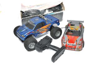 A duo of radio control cars including one petrol powered issue, as shown.