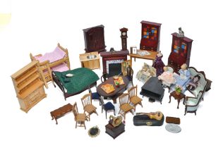 A large assortment of Dolls House Furniture comprising tables, music box (working), chairs, bed,