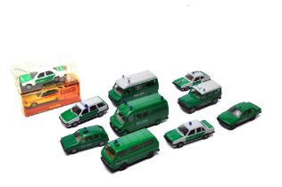 A group of Herpa, Wiking etc plastic vehicles, mostly German police themed as shown.