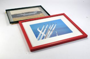 A duo of framed aircraft photographic prints, one depicting the Red Arrows. The other is the BAE