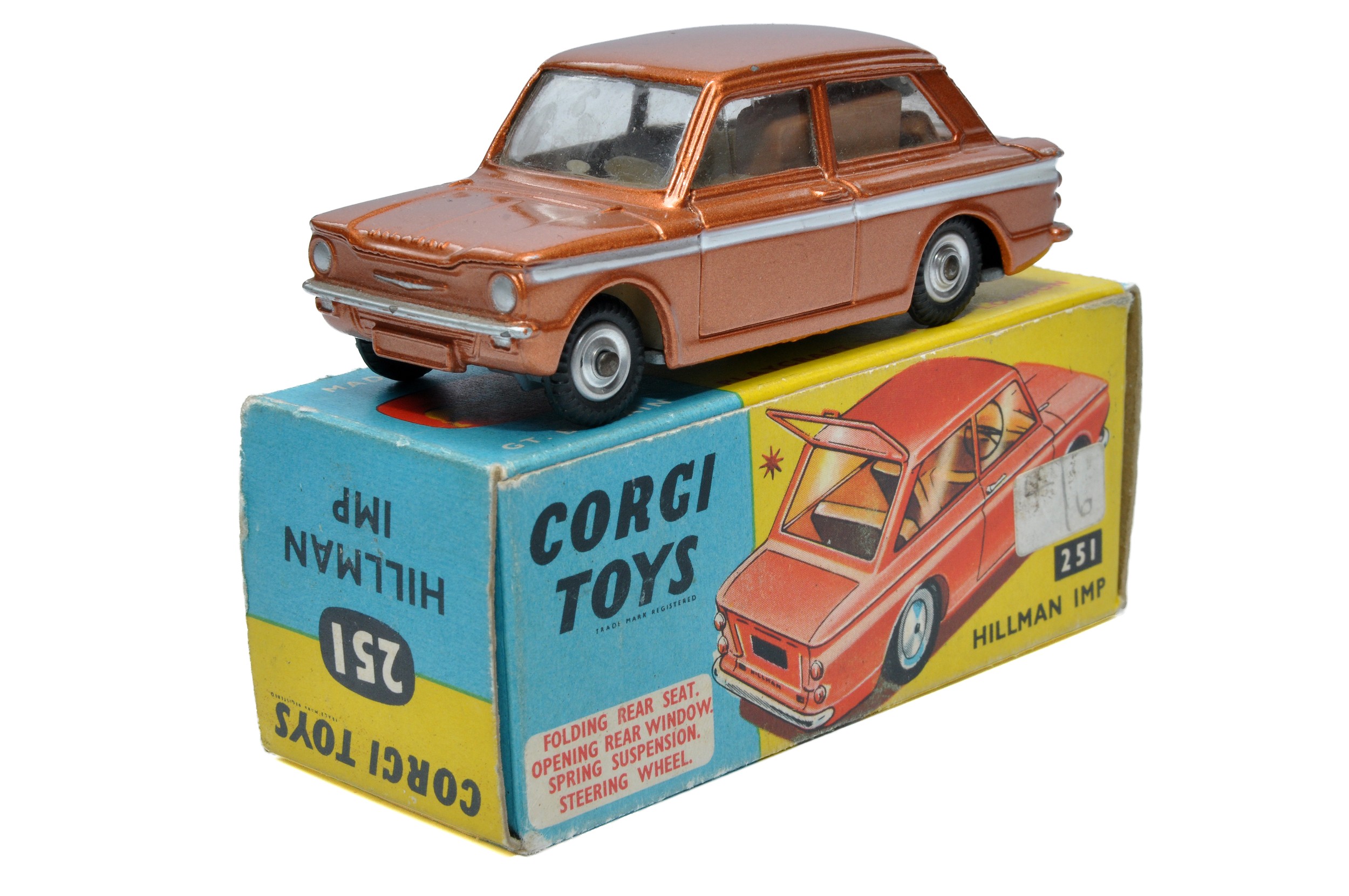 Corgi No. 251 Hillman Imp. Bronze / White trim with light tan interior. Spub Hubs. Generally