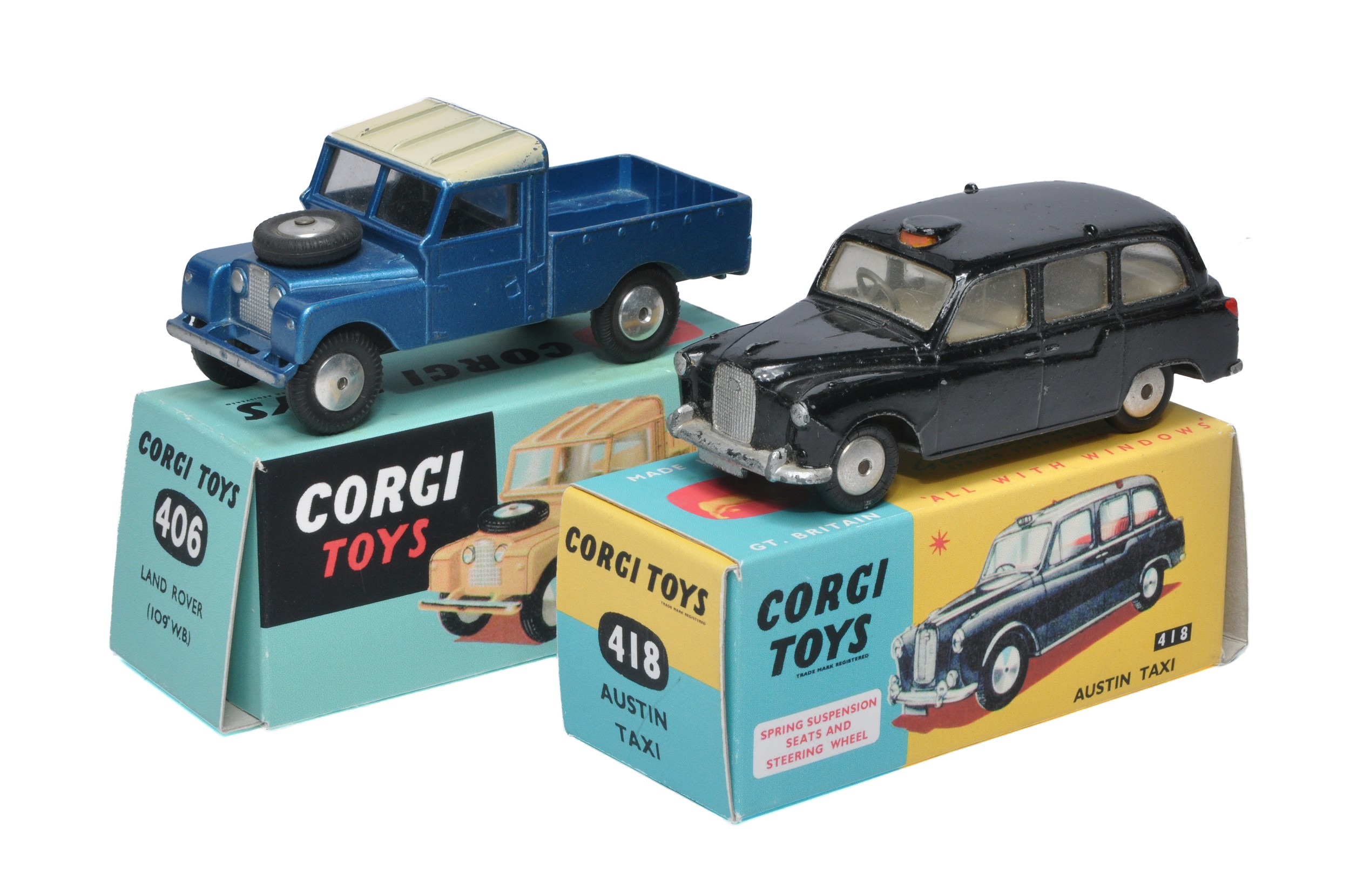 Corgi duo including No. 406 Land Rover and No. 418 Austin Taxi. Models display generally good and