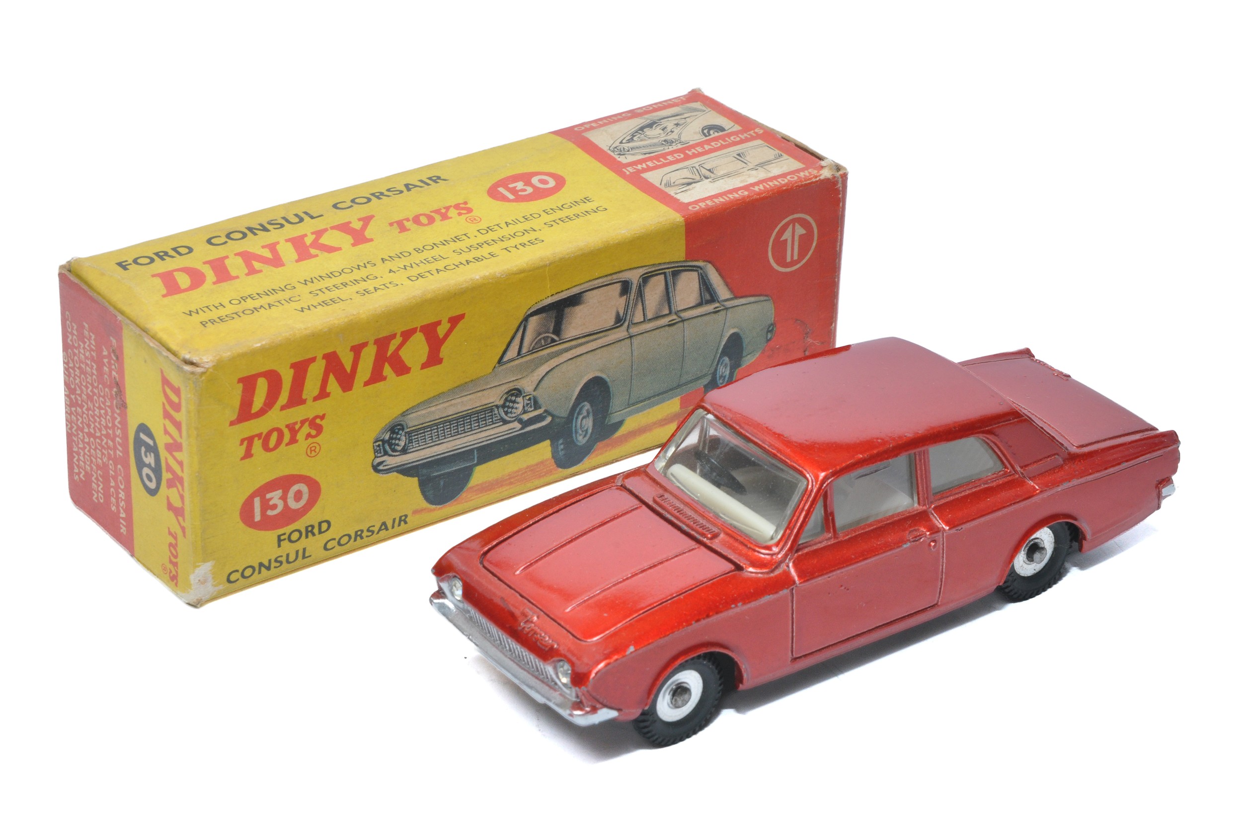 Dinky No. 130 Ford Consul Corsair. Metallic red with off-white interior. Displays very good with the