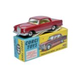 Corgi No. 230 Mercedes 220SE Coupe. Burgundy / maroon with lemon interior. Spun Hubs. Generally