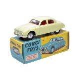 Corgi No. 208S Jaguar 2.4L Saloon. Pale yellow with red interior. Flat spun hubs. Generally displays