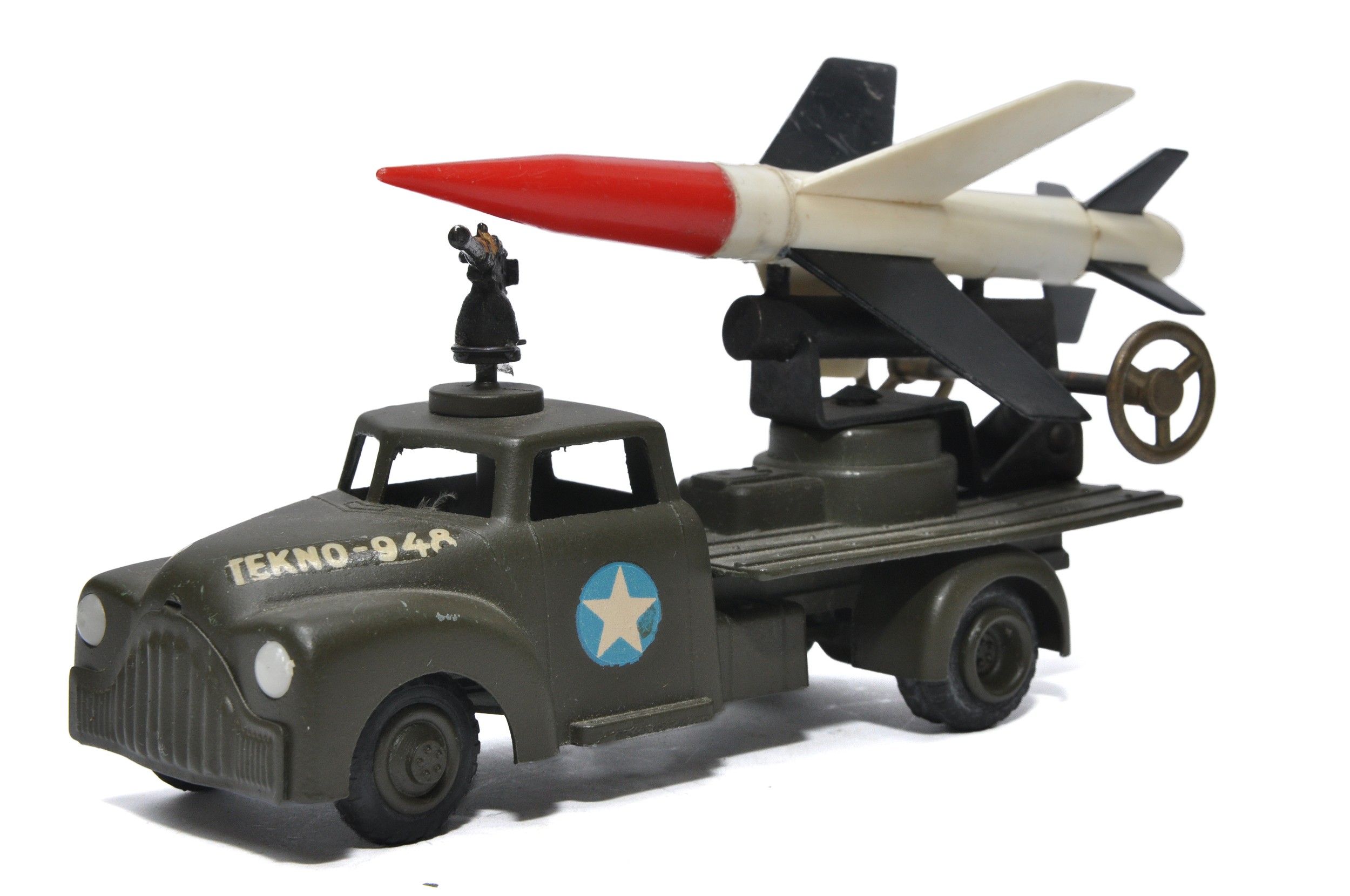 Tekno early issue Rocket Launcher with trio of rockets on back, missing roof gun. Displays good to - Image 2 of 3