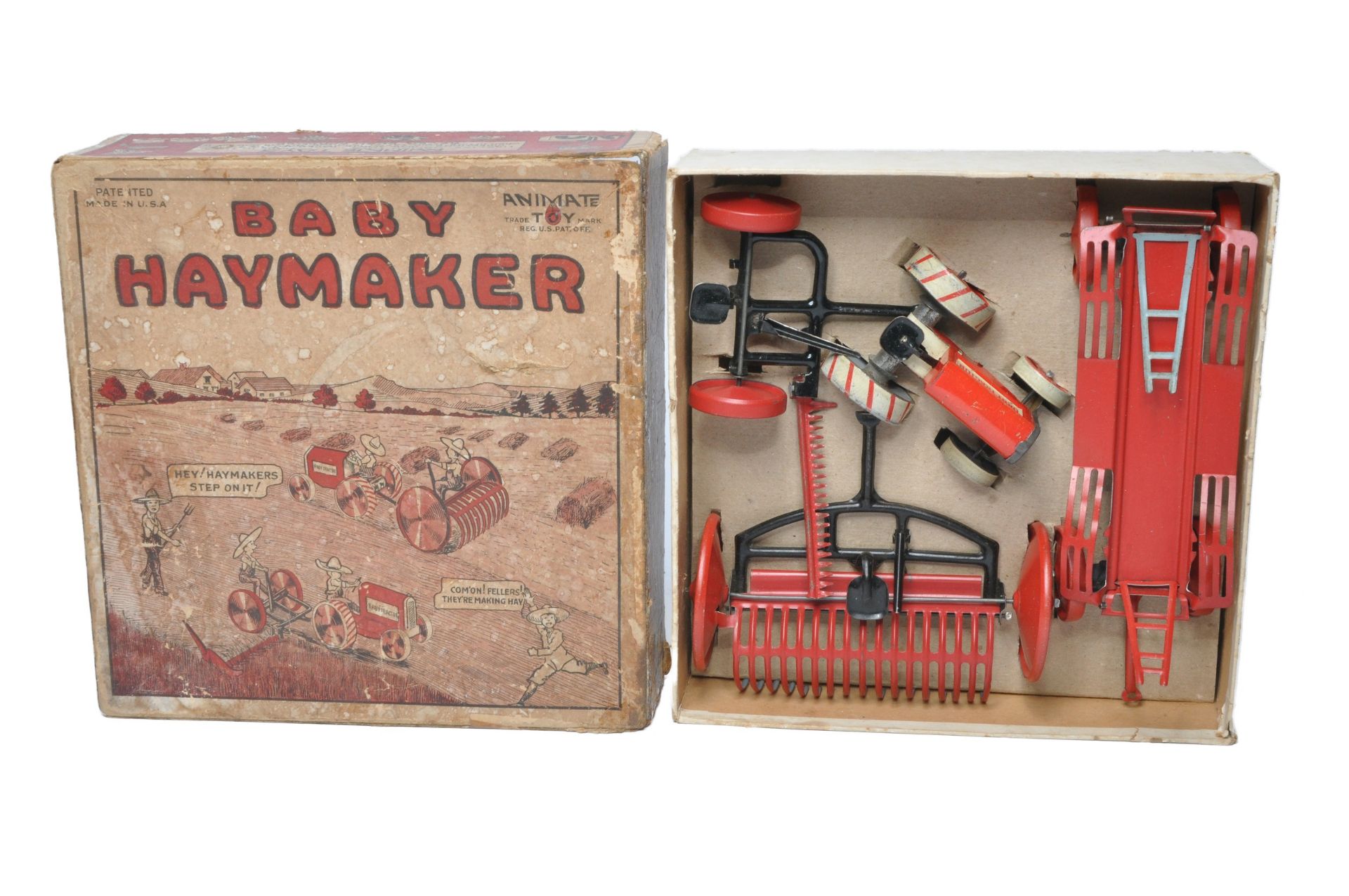 Animate (USA) 1920's Tinplate Baby Haymaker Tractor and Implement Set. Contents display excellent as